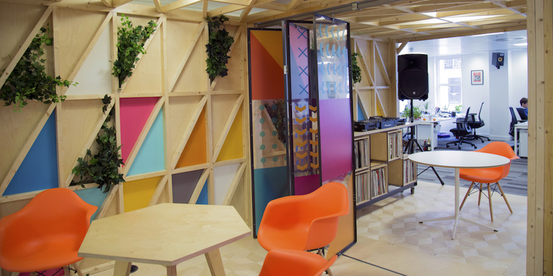 Colourful office den with table and chairs